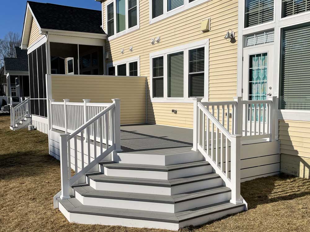 Deck with flare steps and white vinyl rail