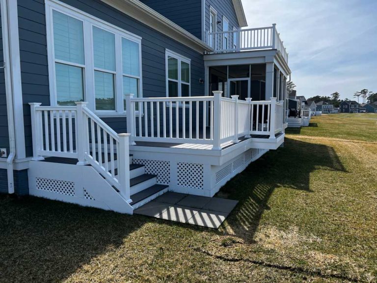 Gray deck with white rails and lattice