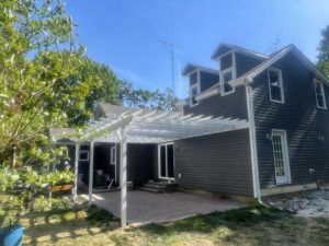 White pergola over patio