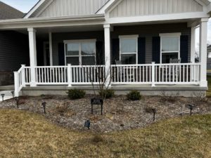 White vinyl rail install on front porch