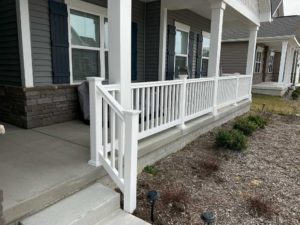 White vinyl rail install on front porch