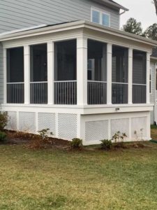 Screened porch with white trim and lattice