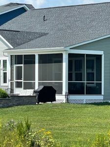 Screened porch with white trim and lattice